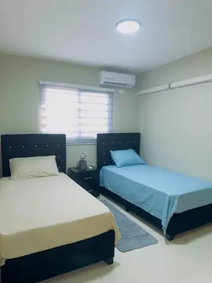 a bedroom with two beds and a window at Excelente Apartamento Completo Renta Carro Disponible in La Viva