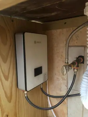 a wall with a computer monitor hooked up to a pipe at Casa Playa Rincon Hills Samana Las Galeras by BTC Group Crypto in Castellalito