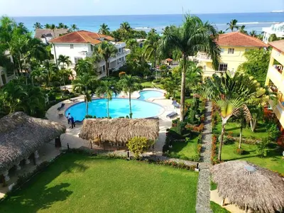an aerial view of a resort with a swimming pool and the ocean at Boca chica retreat in Boca Chica