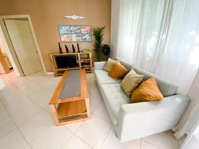 a living room with a couch and a coffee table at Gorgeous apartment steps to Playa Punta Popy in Las Terrenas