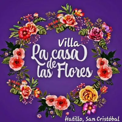 a sign with a wreath of flowers on a purple background at Villa Tulum in San Cristóbal
