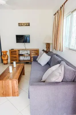 a living room with a couch and a coffee table at la fenice un apartamento de ensueño en Las Terrenas playa Punta Popy in Las Terrenas