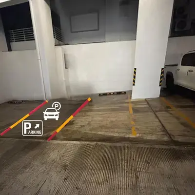 a parking garage with a car parked in it at Tu guarida in Santo Domingo