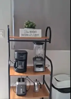 a shelf with a blender and a coffee maker on it at Flamingo Villa in Boca Paraiso in Boca Chica