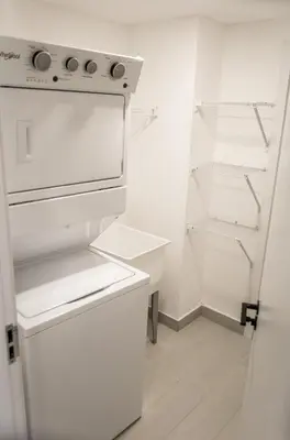 a kitchen with a white stove and an open refrigerator at Luxury Apartment Rooftop With Two Level and Infinitive Pool in Santiago de los Caballeros