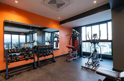 a gym with two treadmills and two ellipticals at Luxury Apartment Rooftop With Two Level and Infinitive Pool in Santiago de los Caballeros