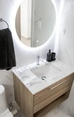 a bathroom with a sink and a mirror at Luxury Apartment Rooftop With Two Level and Infinitive Pool in Santiago de los Caballeros
