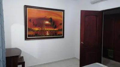 a painting hanging on a wall in a room at Apartment Rozarka Soficu El Edén Dominicus in La Laguna