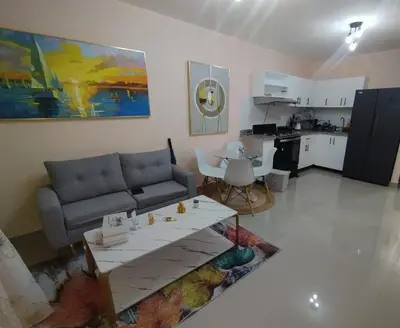 a living room with a couch and a table at El descanso perfecto in El Cruce
