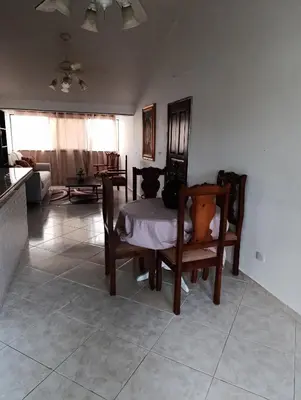 a living room with two chairs and a table at acuario residencial 2 in La Viva
