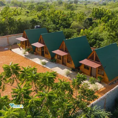 an aerial view of a resort with green roofs at VillaSol un descanso en pedernales in Pedernales