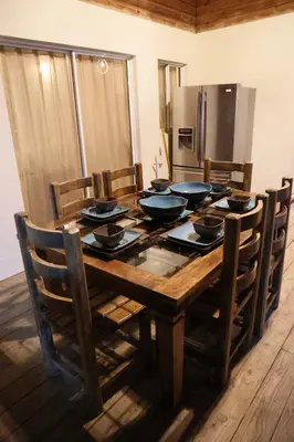 a dining room table with bowls on top of it at Villa Claudia Constanza in Arroyo Frío