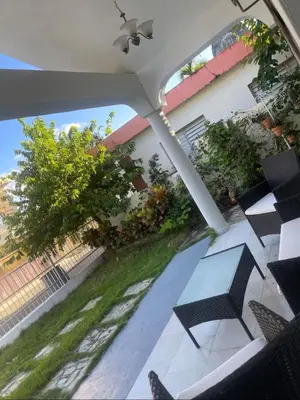 a view of a patio with a table and chairs at Your best escape in Dominican Republic!! in Santiago de los Caballeros