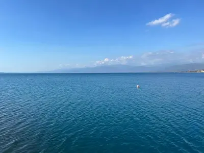a large body of blue water with a buoy in it at Villa Rosa Bella Perfect for families or groups in Palmar de Ocoa