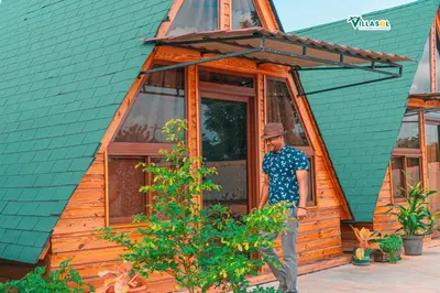 a man standing outside of a tiny house at Villasol Pedernales in Pedernales