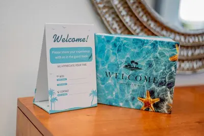 a welcome sign and a box on a table at Beautiful ocean and mountain view villa in Gaspar Hernández