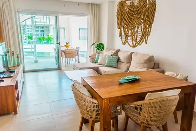 a living room with a table and a couch at Punta cana apparment close to the beach in Punta Cana