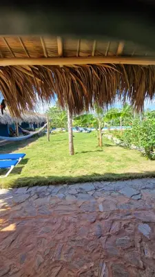 a view of a resort with a grass roof at Gecko Azul, Las Galeras in Las Galeras
