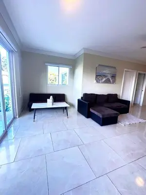 a living room with a couch and a table at Itzayana 1 in Las Terrenas