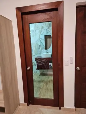 a bathroom door with a mirror and a sink at Villa Jardín Tropical 2 in Las Galeras