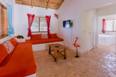 a living room with a couch and a table at Paradiso del Caribe Apartments A1 and A2, Your Perfect Stay in Las Galeras in Las Galeras