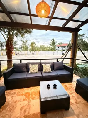 a living room with a couch and a table at GH Condos by Sunrise3 in Puerto Plata