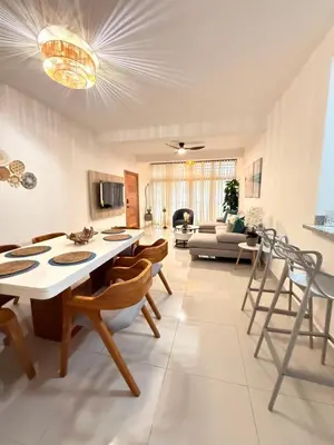 a living room with a table and chairs at GH Condos by Sunrise3 in Puerto Plata