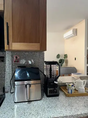 a kitchen counter with a coffee maker and a toaster at GH Condos by Sunrise1 in San Felipe de Puerto Plata