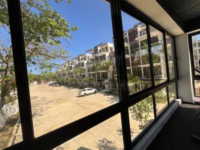 a view from a window of a parking lot at GH Condos by Sunrise1 in San Felipe de Puerto Plata