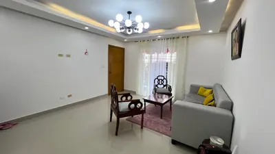 a living room with a couch and a table at AP Filathefia 01 in San Isidro