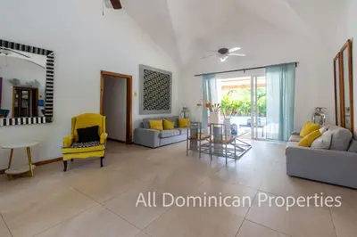 a living room with two couches and a table at Sosua Private villa, 9 br, guest friendly, Up to 20 persons! in Sosúa