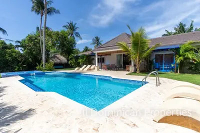 an image of a swimming pool in front of a house at Sosua Private villa, 9 br, guest friendly, Up to 20 persons! in Sosúa