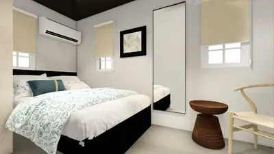 a bedroom with a bed and a mirror and a chair at Santa's Villa Punta Rucia in Punta Rucia