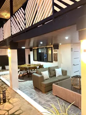 a living room with a couch and a table at Santa's Villa Punta Rucia in Punta Rucia