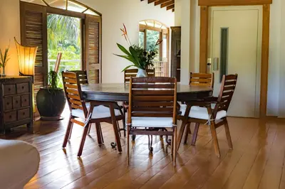 a dining room with a wooden table and chairs at Penthouse beach front in Las Terrenas