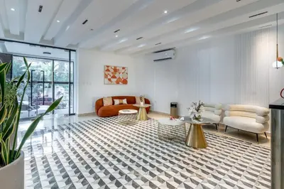 a living room with a couch and a table at Luxury apt city views in the center of the city in Santo Domingo