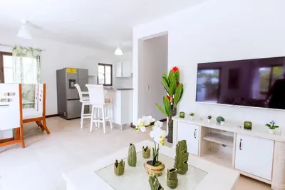 a living room with a large flat screen tv at Villa Retreat in Ibiza, Punta Cana in Punta Cana