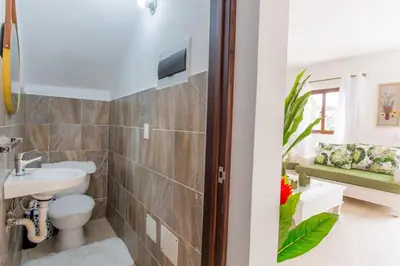 a bathroom with a sink and a toilet at Villa Retreat in Ibiza, Punta Cana in Punta Cana
