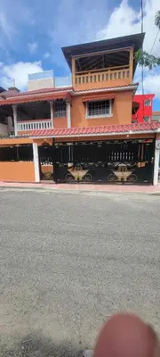 a building on the side of a street with a streetestamp at Casa entrada el cachon lucerna in Cancino Adentro
