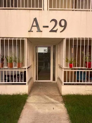 a store front with the numbers on it at Tranquilo Apartamento de 3 habitaciones in Los Paredones