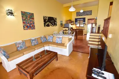 a living room with a couch and a coffee table at Villa Caribeña in Las Galeras