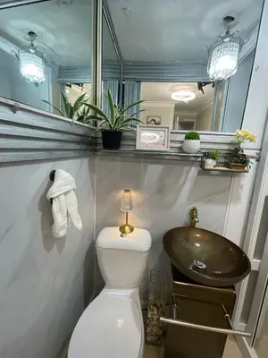 a bathroom with a toilet and a sink at Feair in Santo Domingo