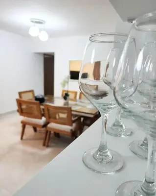 a group of wine glasses sitting on top of a counter at Beautiful Accommodation in La Romana Beach View in La Romana