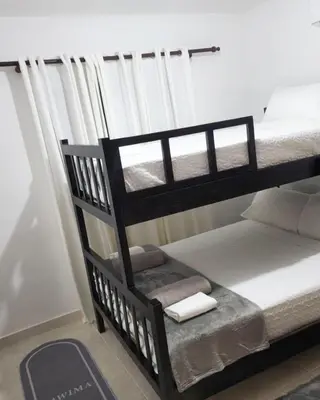 a couple of bunk beds in a room at Beautiful Accommodation in La Romana Beach View in La Romana