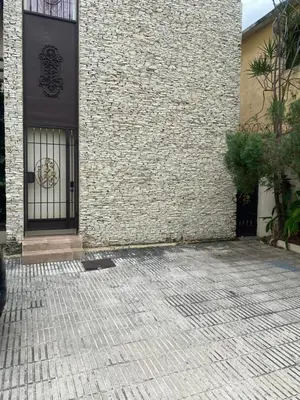 a building with a gate and a brick wall at Jacqueline in Santo Domingo
