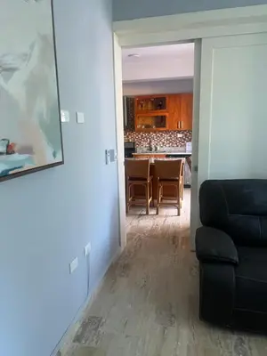 a living room with a couch and a table at Laguna beach in Sosúa