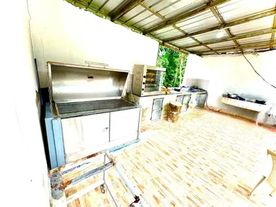 an empty kitchen with a stove and a counter top at Double P Ranch 20 guests, BBQ and pool Buggy rental in Pedro Brand