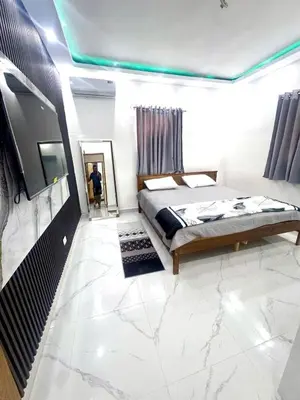 a bedroom with a bed and a flat screen tv at Double P Ranch 20 guests, BBQ and pool Buggy rental in Pedro Brand