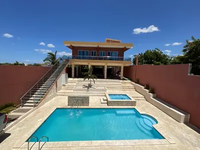 a house with a swimming pool in front of it at Villa Barias in Las Calderas
