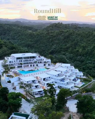 an aerial view of a building with a resort at Luxury Apt with Private Jacuzzi & Pool Near Beach in Las Terrenas